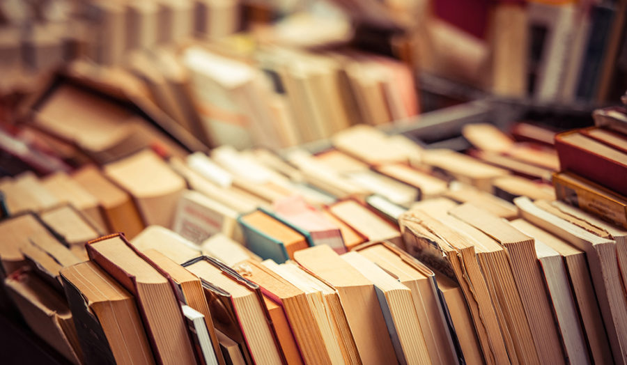 Many old books in a book shop or library. Shallow DOF